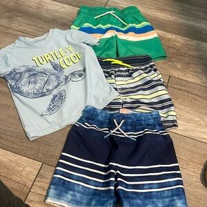 3 pairs of swim trunks and 1 swim shirt